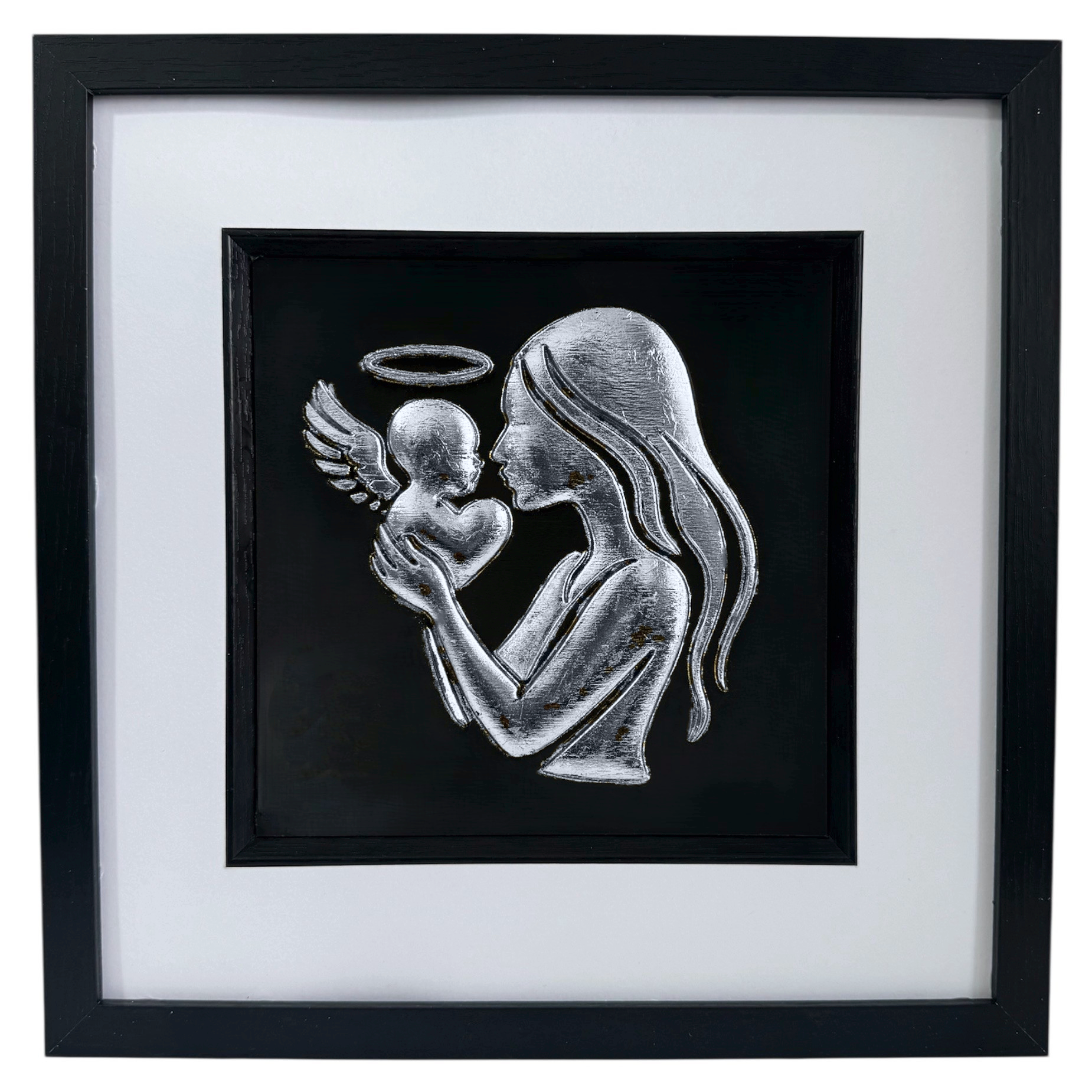 Silver leaf mother and baby angel wall art shown from the front in a black wooden frame with white mount