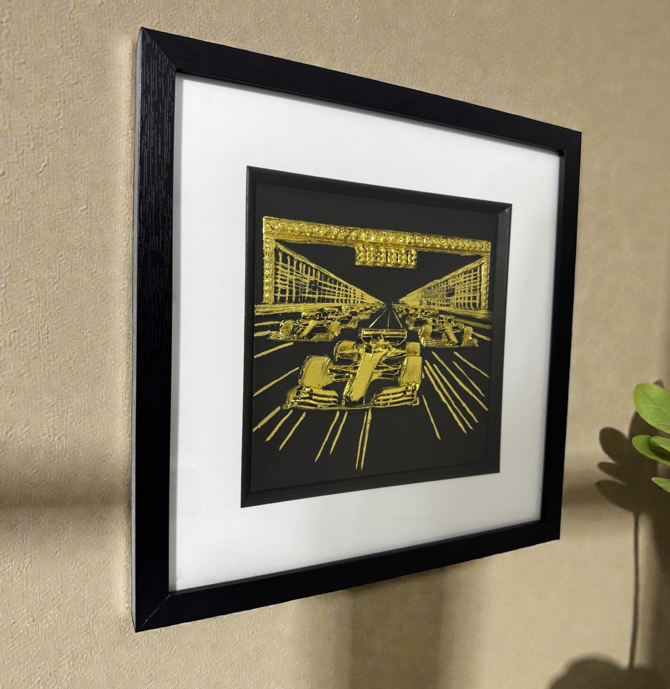 Side view of the F1 art showing the 3D depth of the relief sculpture, with perspective lines leading the eye down the race track.