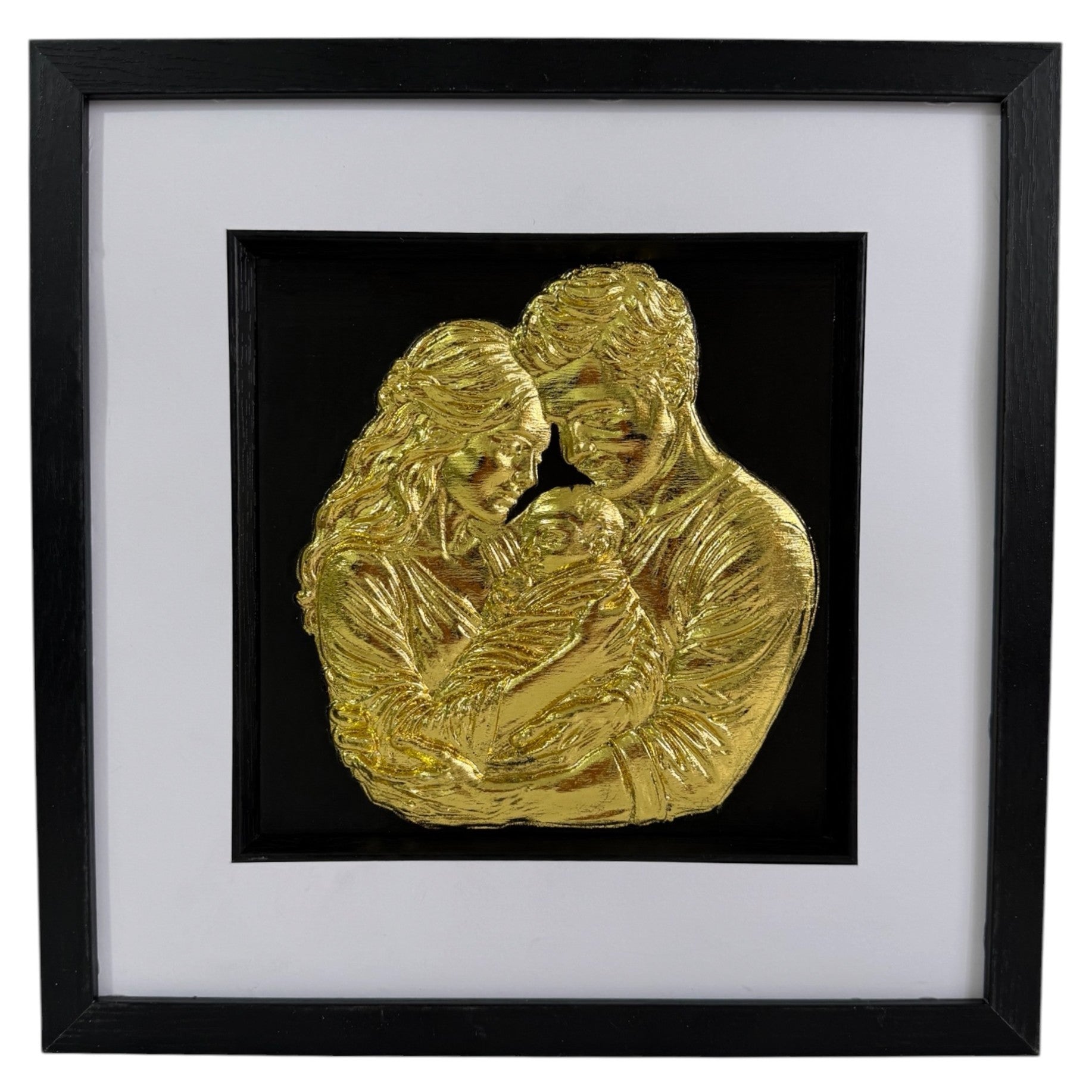 Straight-on Gold finish mum dad and baby relief artwork in a black square frame with white mount.