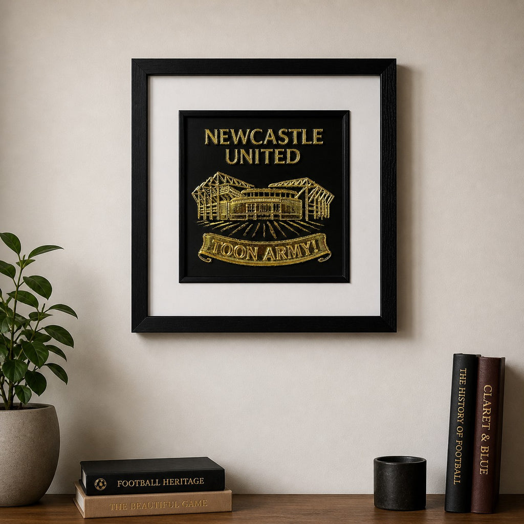 Lifestyle photo of Newcastle United St James’ Park wall art displayed on a neutral wall above a wooden sideboard with home decor.