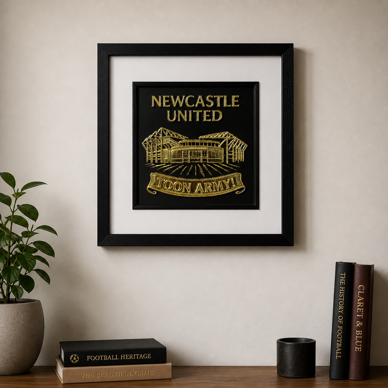 Lifestyle photo of Newcastle United St James’ Park wall art displayed on a neutral wall above a wooden sideboard with home decor.