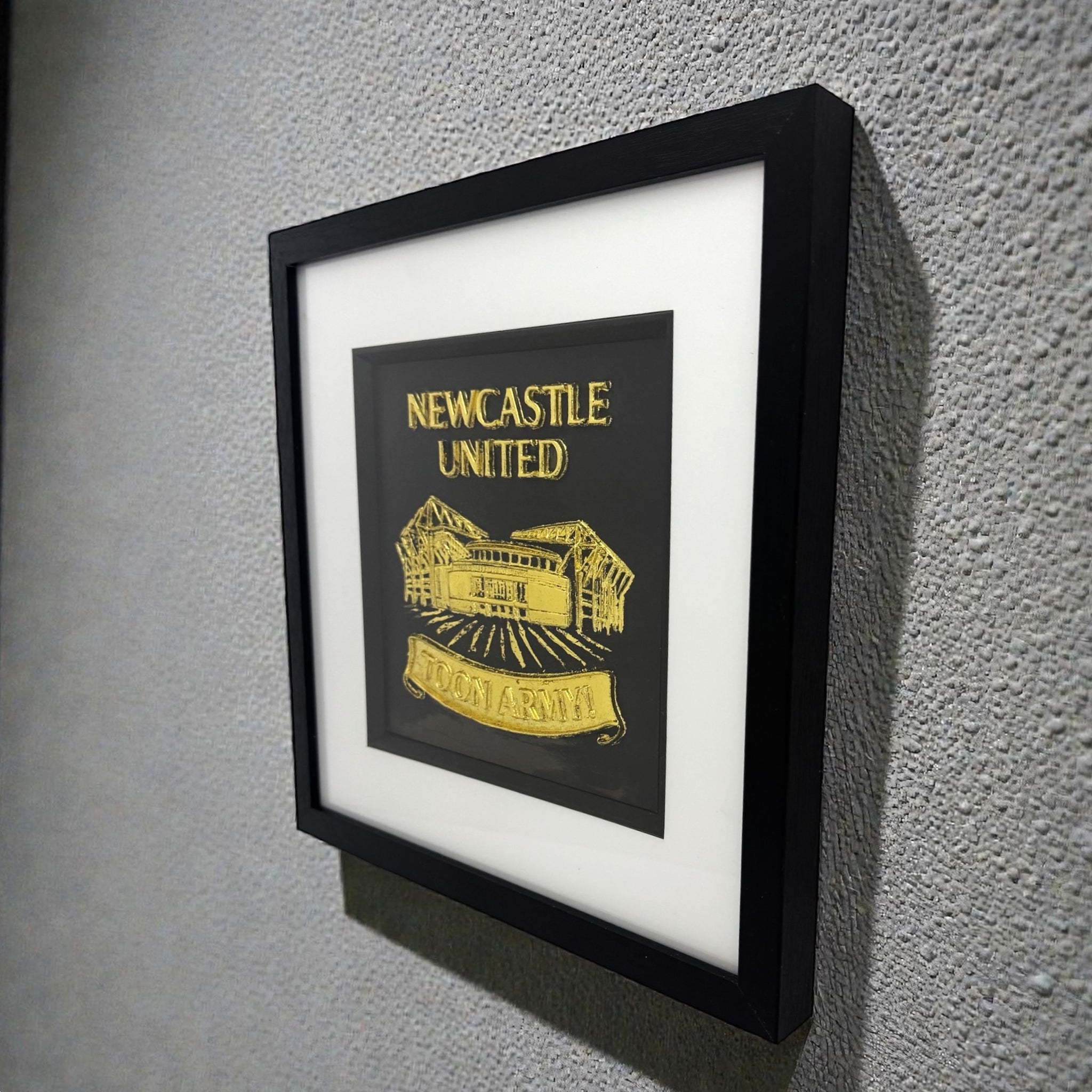 Close up of raised 3D Toon Army banner on Newcastle wall art.