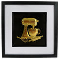 Straight-on gold stand mixer baking artwork with cup, whisk and rolling pin in a black frame with white mount.