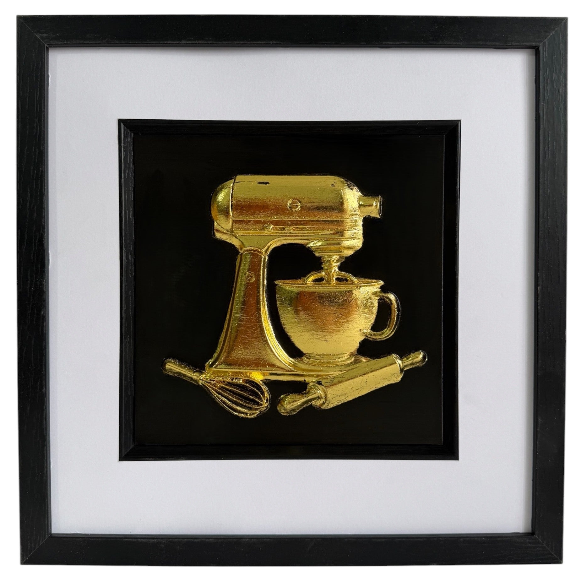 Straight-on gold stand mixer baking artwork with cup, whisk and rolling pin in a black frame with white mount.