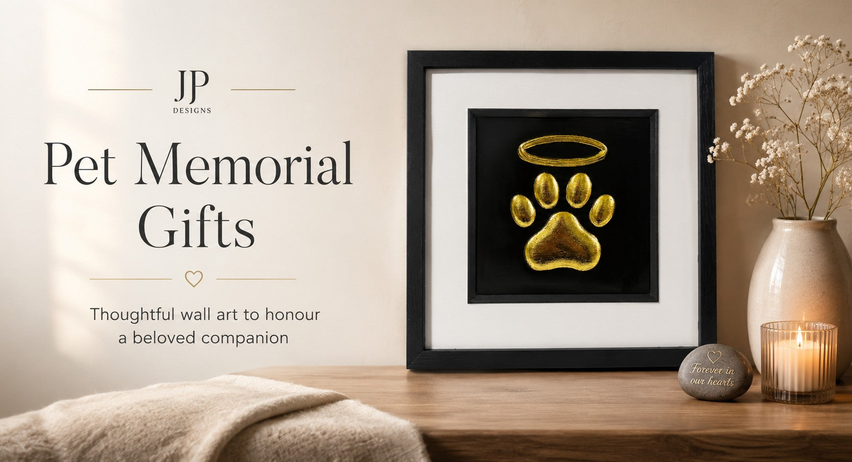 JP Designs pet memorial gifts hero image showing framed gold paw print wall art with halo and remembrance styling
