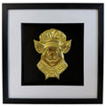 Gold pig chef raised relief in black square frame with white mount and black inner surround