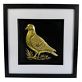 Framed pigeon wall art in gold leaf, front view showing raised relief bird design on black background with white mount