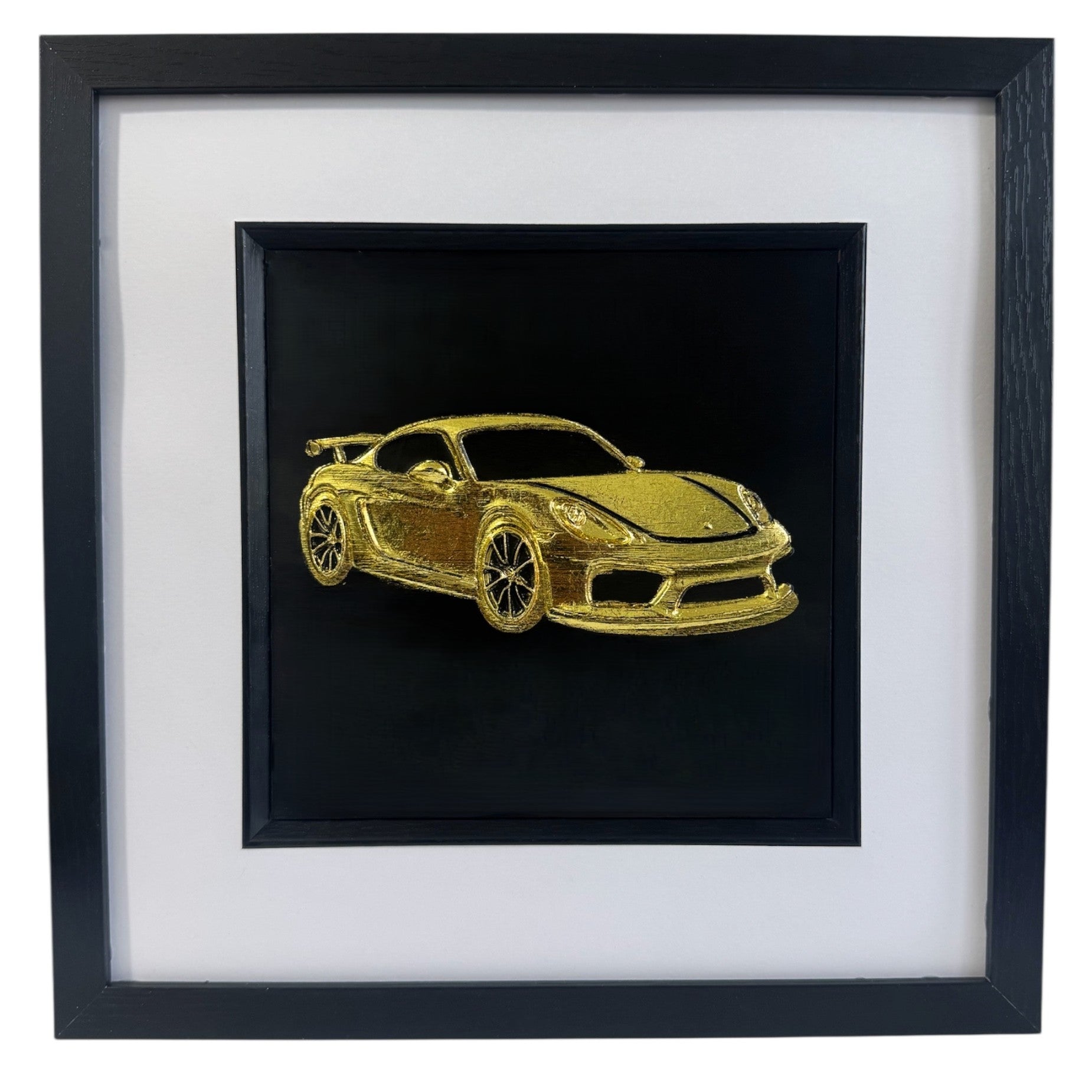 Gold leaf Porsche GT4 wall art in black frame with white mount on black background, framed 33 x 33 cm
