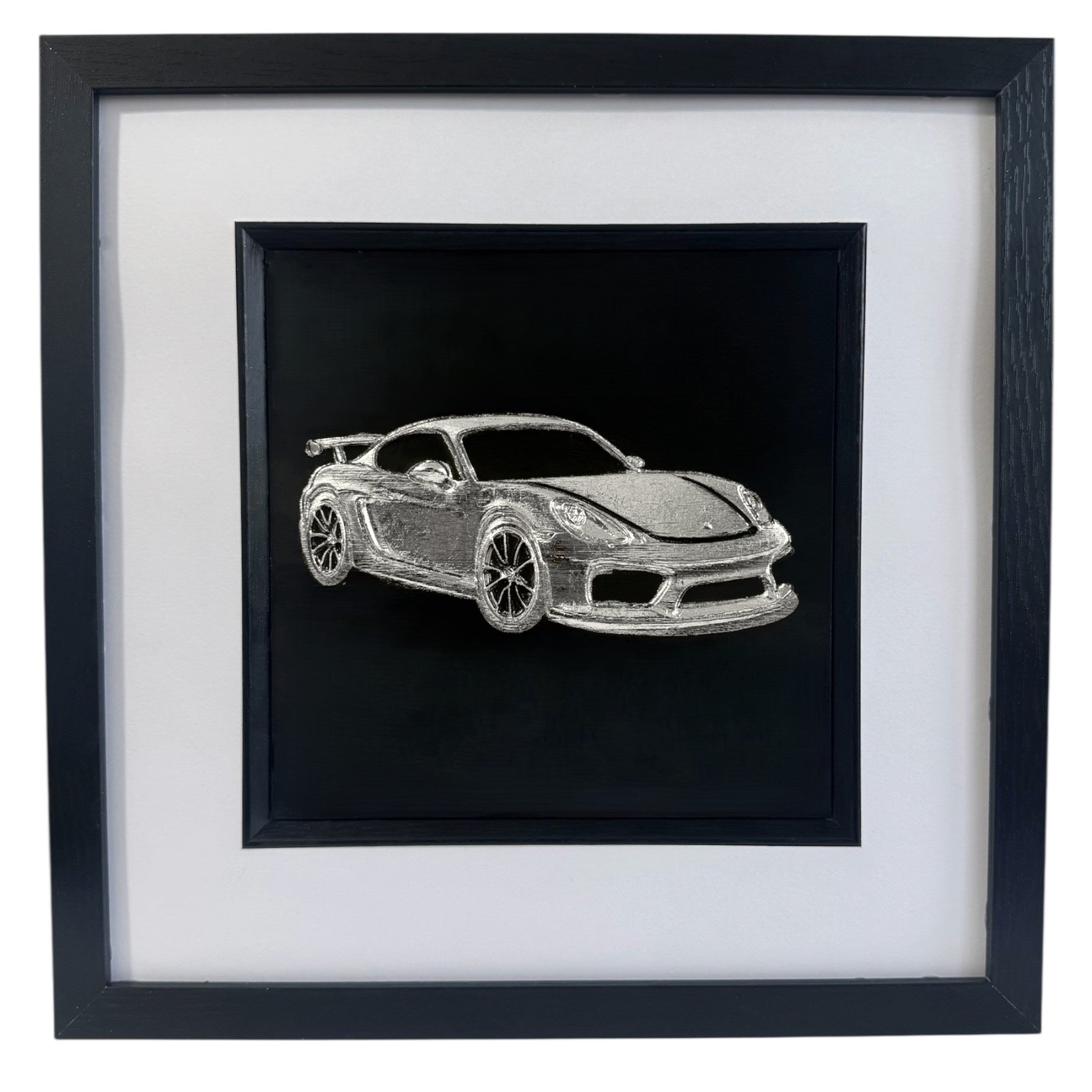 Silver leaf Porsche GT4 wall art in black frame with white mount on black background, framed 33 x 33 cm