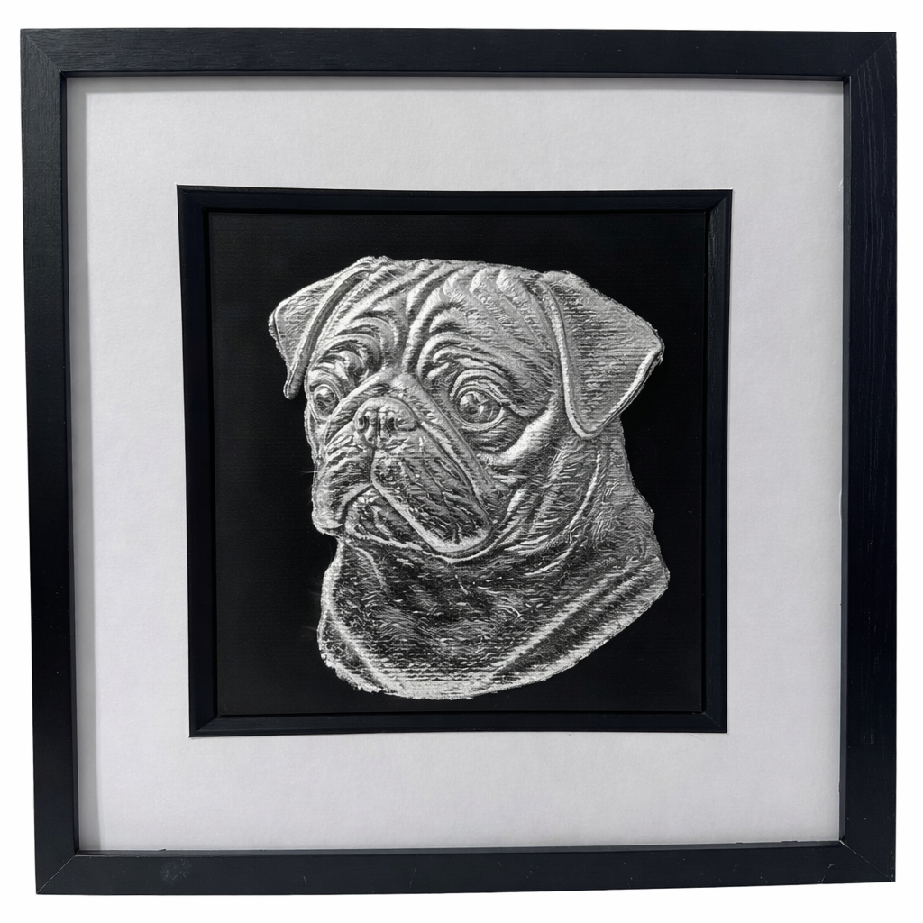 Pug framed wall art in silver leaf shown front on with black wooden frame white mount and black background