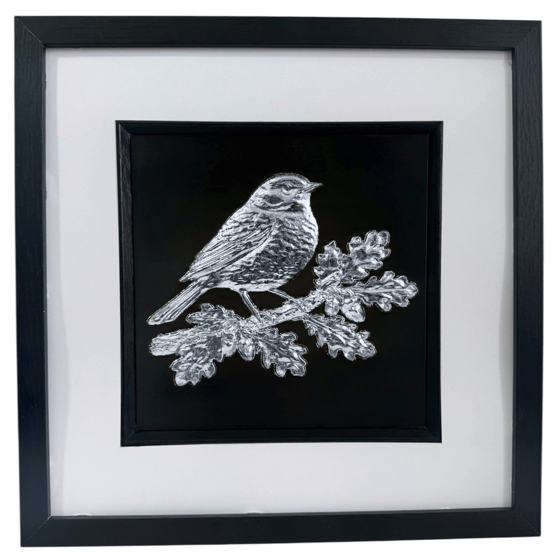 Silver leaf robin wall art perched on an oak branch in black frame with white mount,