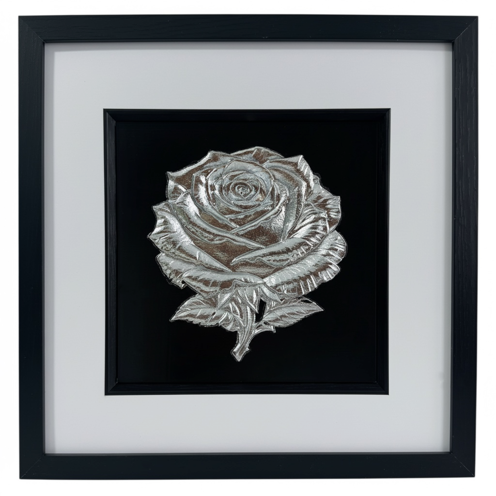 Front-on product photo of framed Silver Leaf rose relief on black surround, with wide white mount and black square frame.
