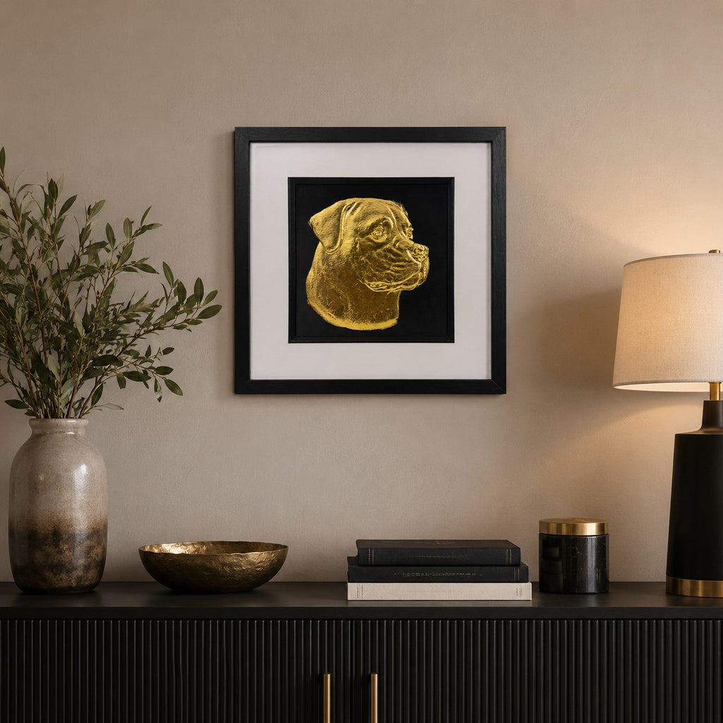 Rottweiler gold leaf framed dog wall art displayed in a modern neutral home interior with black frame, white mount, black background, and warm gold accents.