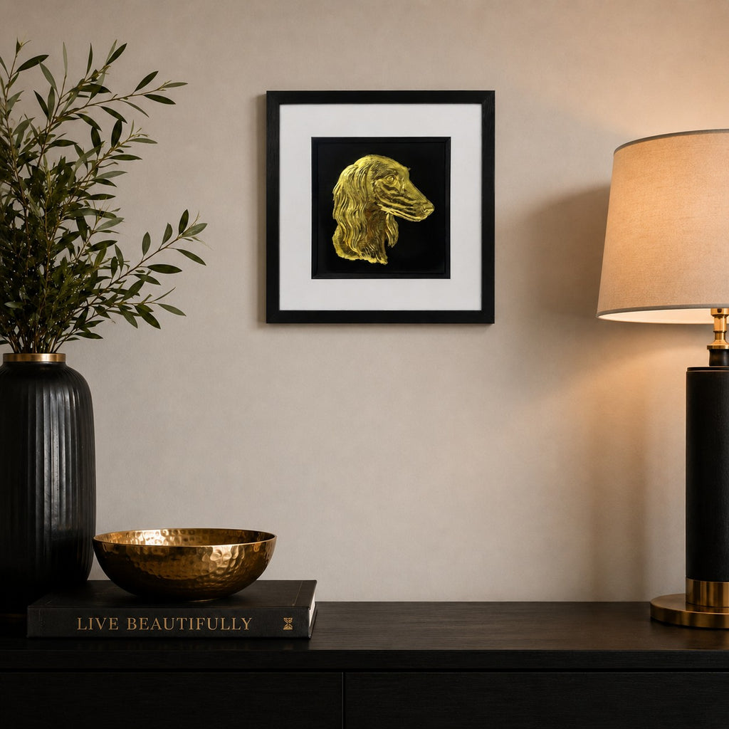 Saluki gold leaf framed dog wall art displayed in a modern neutral home interior with black frame, white mount, black background, and warm gold accents.