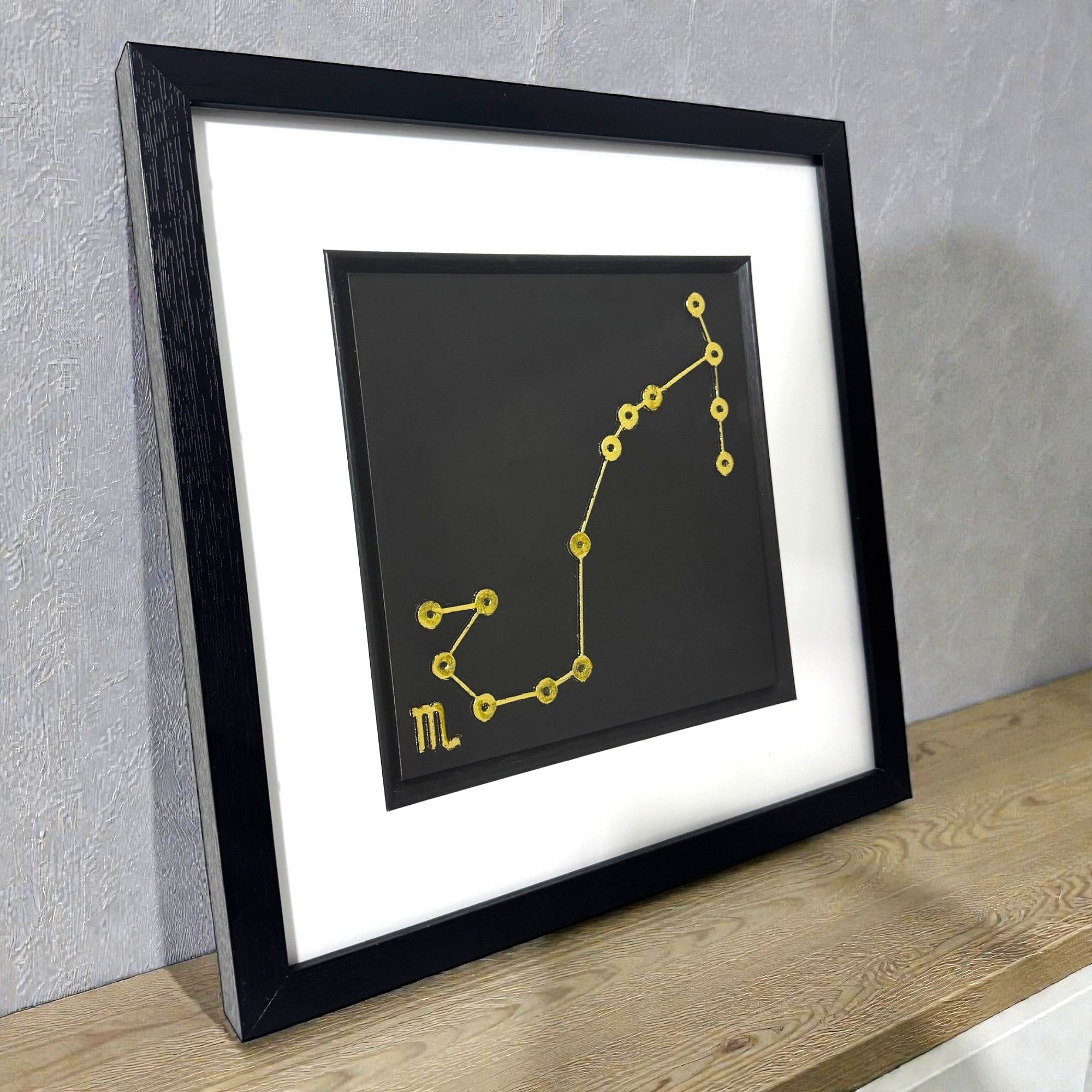 Side view of framed Scorpio constellation wall art showing depth
