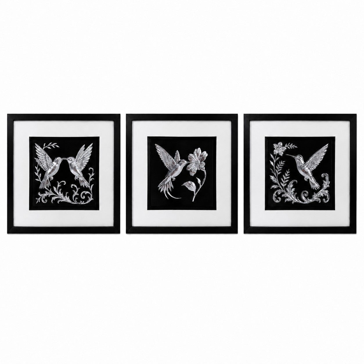 Set of three framed silver hummingbird wall art pieces displayed side by side on a white background, featuring black frames, white mounts and detailed silver leaf style bird and floral designs.