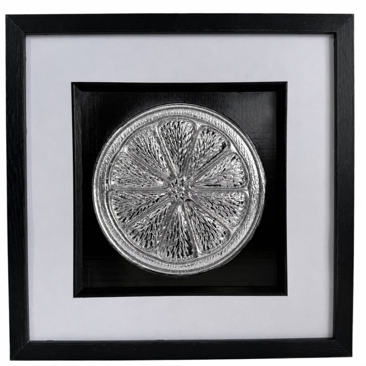 Silver citrus slice 3D relief artwork with black centre panel, white mount and black frame.