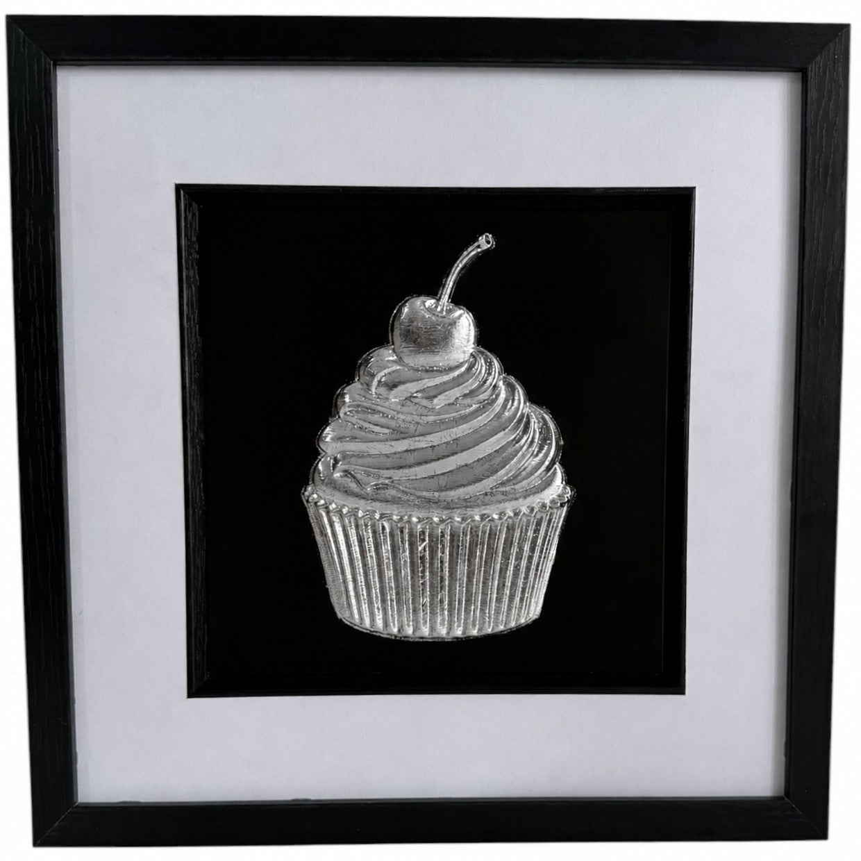 Silver cupcake relief artwork in a black square frame with white mount and black inner surround.