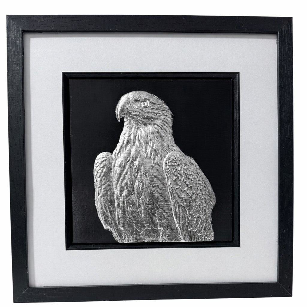 Eagle framed wall art in silver leaf on black background with white mount