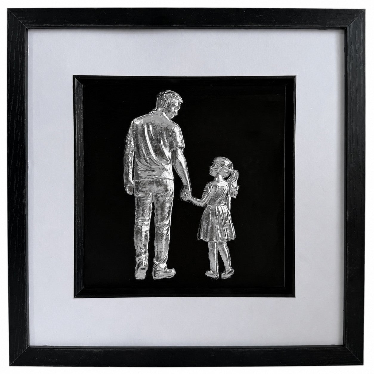 Framed silver father and daughter wall art featuring a parent and child holding hands on a black background with a white mount and black frame.