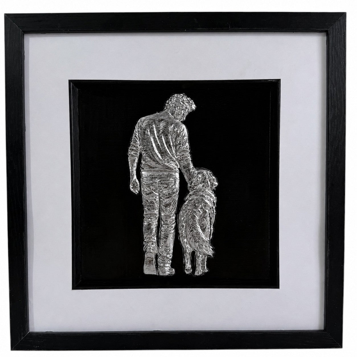 Silver finish framed 3D man and dog artwork with black background, white mount and black square frame.