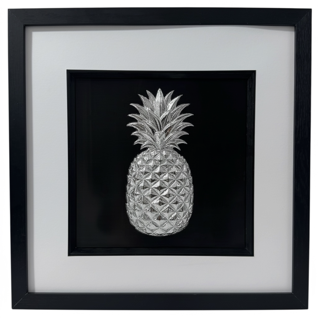 Silver leaf pineapple relief artwork in a deep black box frame with white mount and inner black surround, square framed wall art on black background