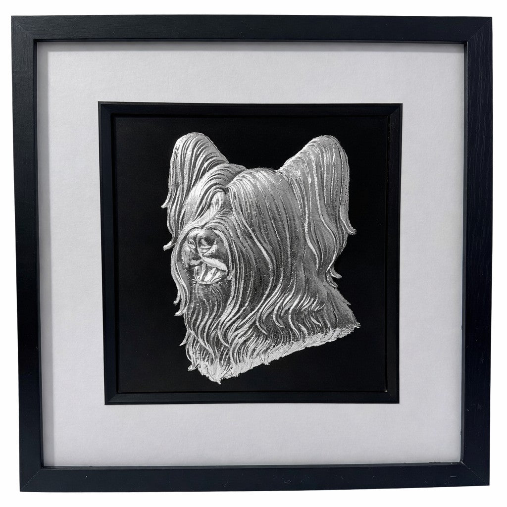 Skye Terrier framed wall art in silver leaf shown front on with black wooden frame white mount and black background