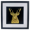 Gold stag wall art centred in black frame with white mount on a light background