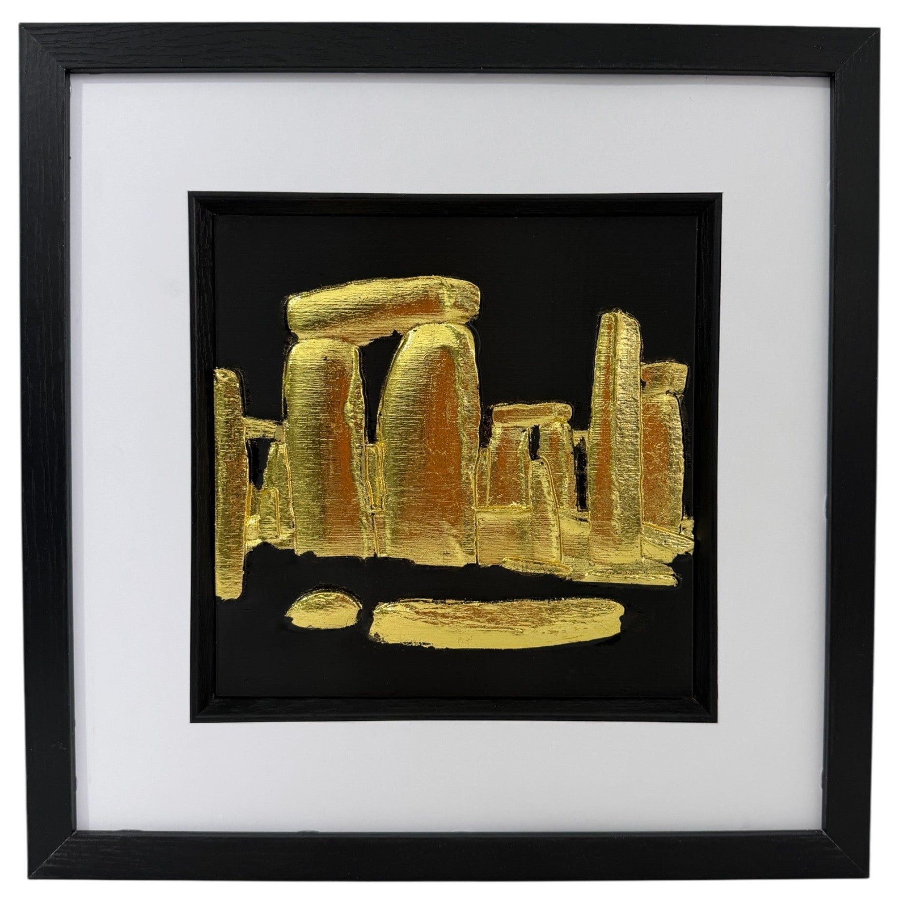 Gold Stonehenge raised relief in a black frame with white mount and black inner surround on a white background.