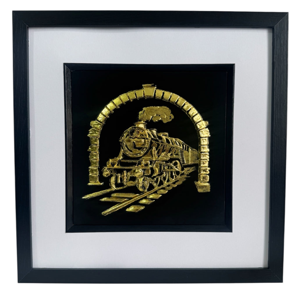 Front view of steam locomotive 3D relief artwork in Gold Leaf on black background with white mount in a black box frame