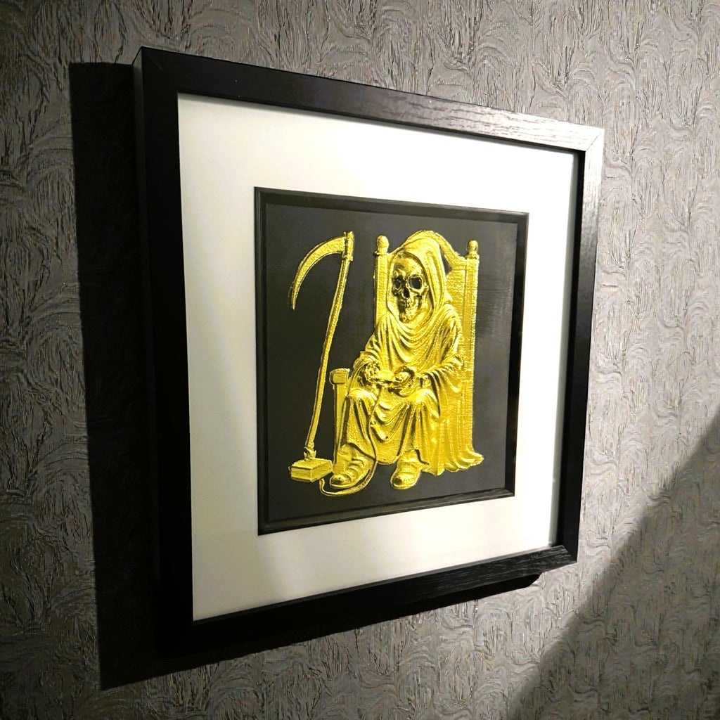 Framed Grim Reaper gamer wall art in gold leaf with white mount on the textured wall