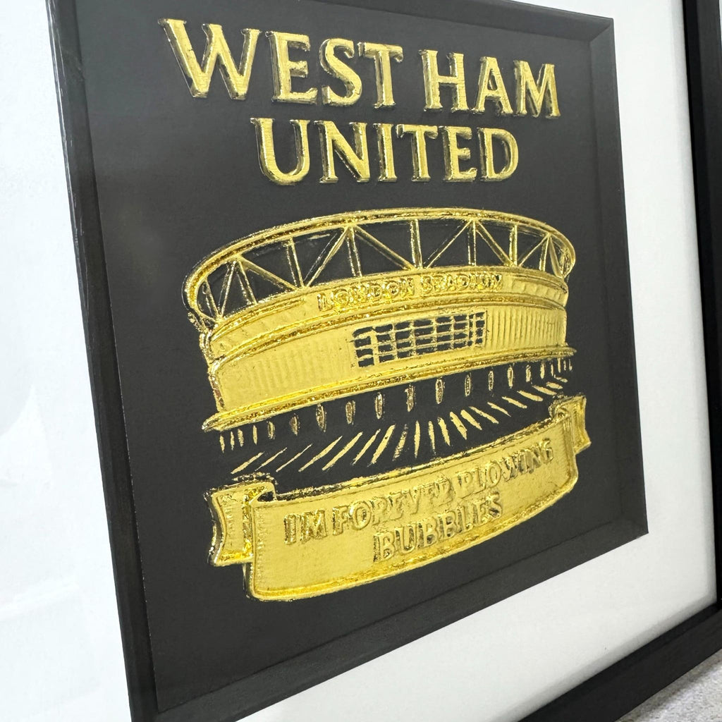 Close up of West Ham United London Stadium raised relief wall art in gold leaf with Im Forever Blowing Bubbles banner