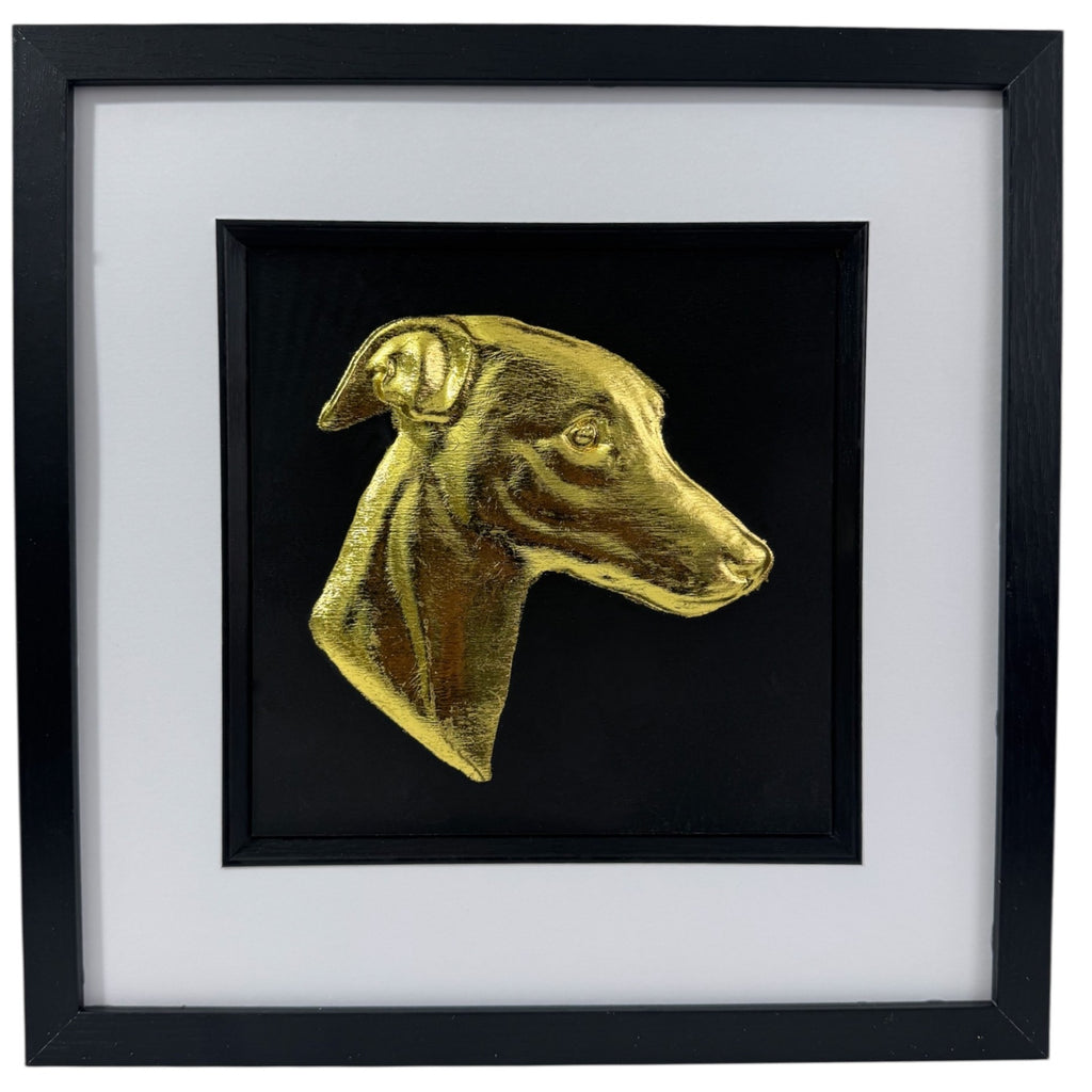 Whippet framed wall art in gold leaf shown front on with black wooden frame and white mount