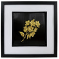 Straight-on gold 3D botanical flower bouquet artwork with raised metallic petals on a black centre panel