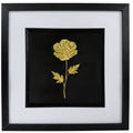 Gold framed flower wall art with raised wildflower relief, black centre, white mount and black frame.