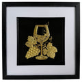 Gold wine glass and grape raised relief artwork in a black frame with white mount and black inner surround.